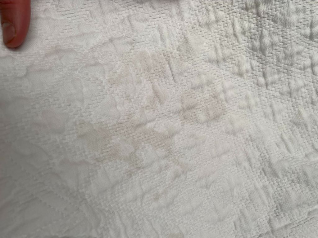 Why do my clothes have grey stains after washing